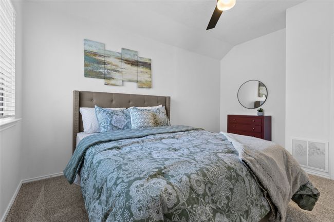 Bedroom with carpet, lofted ceiling, and ceiling fan | Image 16