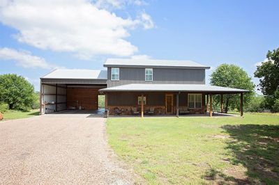 Front of property with a yard and a carport | Image 2