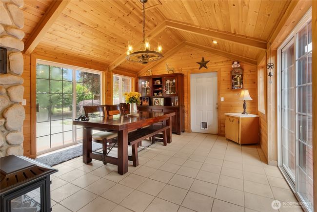 Dining room with sliders to the backyard (left) and front yard (right) | Image 13