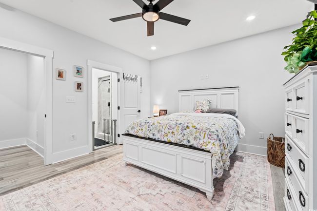Bedroom featuring light wood-type flooring, recessed lighting, and ceiling fan | Image 18