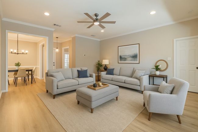 Living room featuring recessed lighting, light wood-type flooring, and ceiling fan with notable chandelier | Image 7