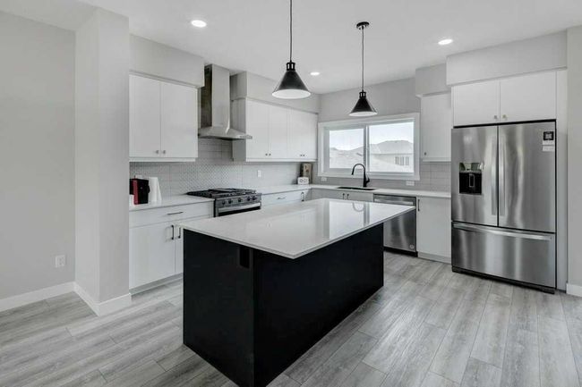 82 Edith Green Nw, Home with 4 bedrooms, 3 bathrooms and 2 parking in Calgary AB | Image 5