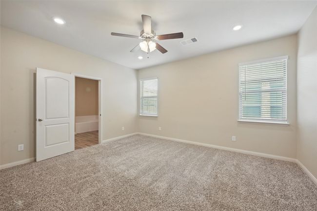 Unfurnished room with baseboards, recessed lighting, a ceiling fan, carpet floors, and visible vents | Image 15