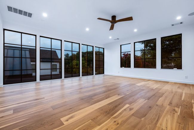 Unfurnished room with a ceiling fan, wood finished floors, and recessed lighting | Image 24