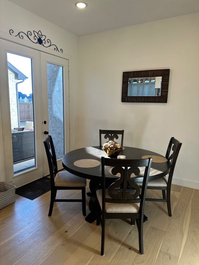 Dining space with french doors, light wood-type flooring, and baseboards | Image 17