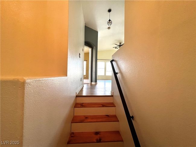 Staircase with a textured wall | Image 4