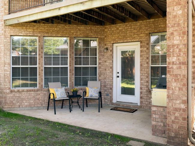 Property entrance with a patio area and brick siding | Image 33