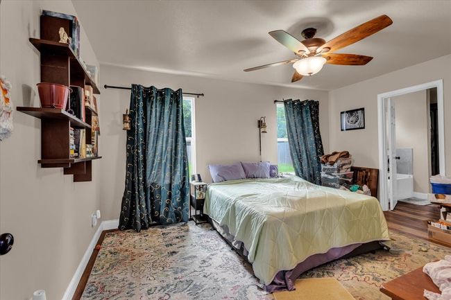 Bedroom featuring wood finished floors and a ceiling fan | Image 13