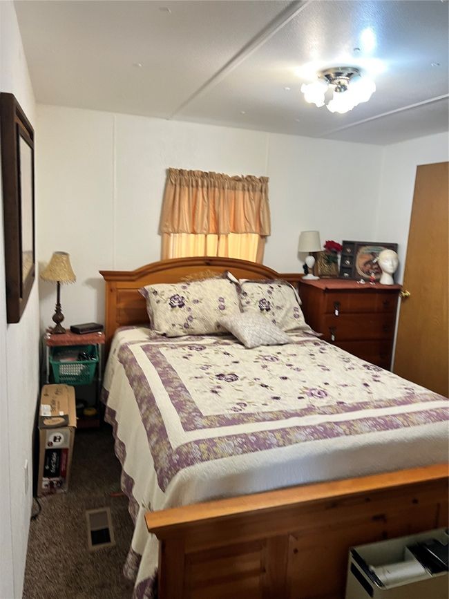 Bedroom with dark carpet | Image 32