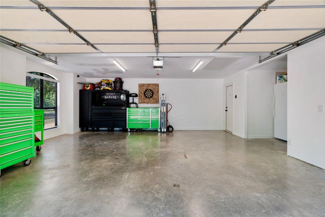 Garage with freestanding refrigerator and a garage door opener | Image 20