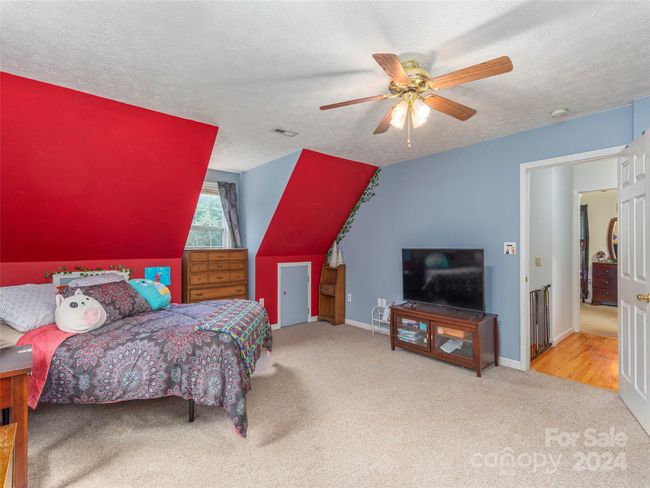 Another view of guest bedroom with abundant storage. | Image 13