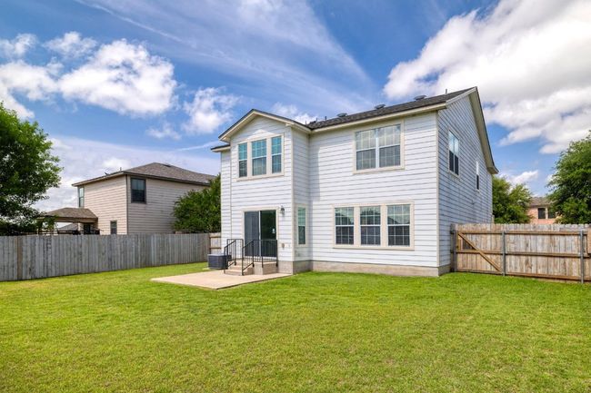 Back of house featuring a yard, a patio, and a fenced backyard | Image 33