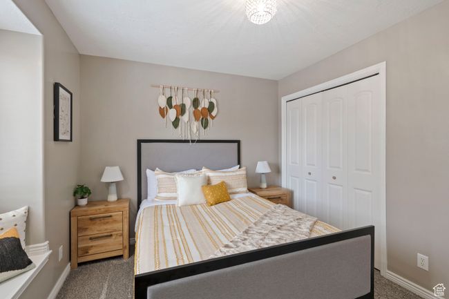 Bedroom featuring a closet and carpet flooring | Image 18