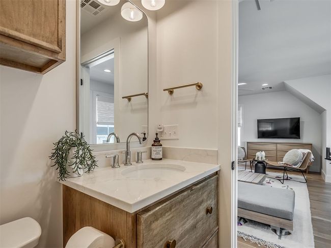 Bathroom with vanity, wood finished floors, toilet, and recessed lighting | Image 38