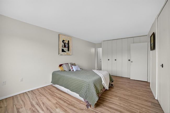 Bedroom featuring light wood-style floors and a closet | Image 27
