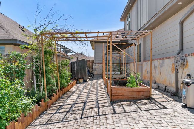 View of patio / terrace with a garden, fence, and a pergola | Image 35