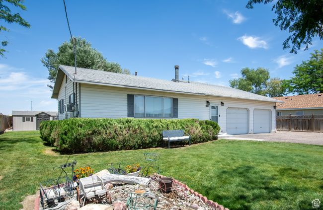 Single story home with an attached garage and driveway | Image 27