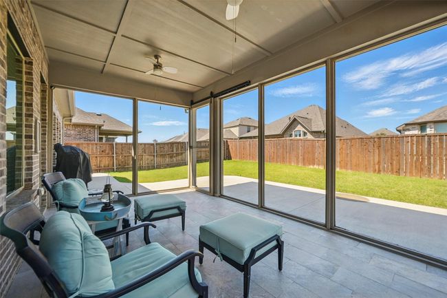 Sunroom with a ceiling fan | Image 21