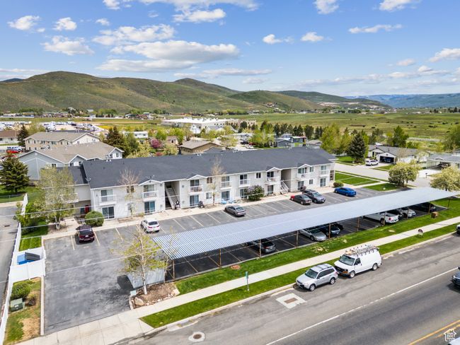 Aerial view of residential area featuring a mountain backdrop | Image 31