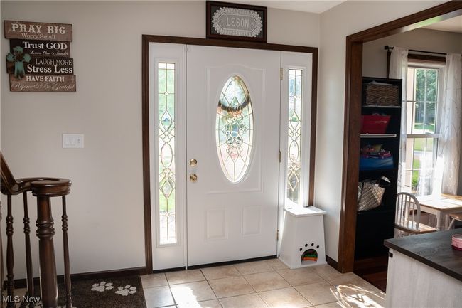 Foyer with healthy amount of natural light and light tile patterned floors | Image 13