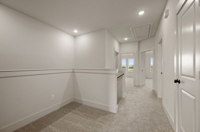 The loft at the top of the stairs makes a perfect pocket office or reading nook. | Image 10