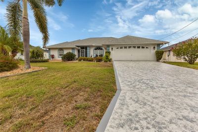 Beautifully 3 bed/ 2 and 1/2 bath waterfront pool home, just waiting for YOU. | Image 3