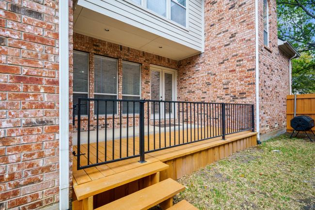 View of side yard of property and deck | Image 20