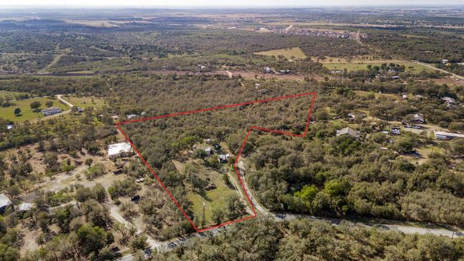 View of rural area featuring a heavily wooded area and property parcel outlined | Image 18