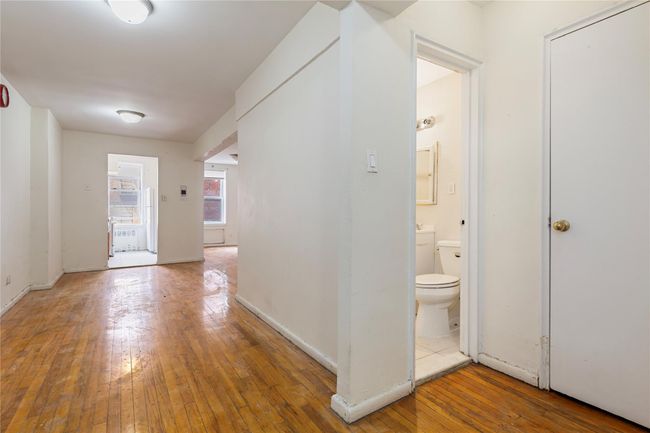 Corridor with hardwood / wood-style floors and baseboards | Image 10