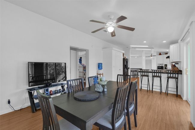 Dining space with ceiling fan, light wood-style floors, and recessed lighting | Image 8