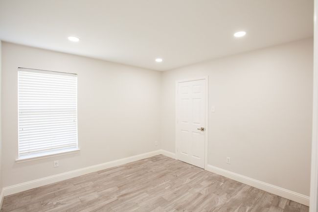 Spare room featuring light wood-style floors and recessed lighting | Image 34