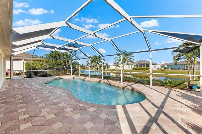 Pool featuring a lanai, a water view, and a patio | Image 30