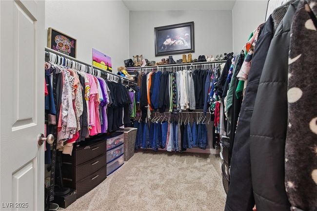 Walk in closet with carpet floors | Image 20
