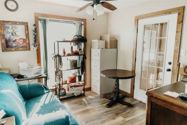 Office space with wood finished floors and ceiling fan | Image 28