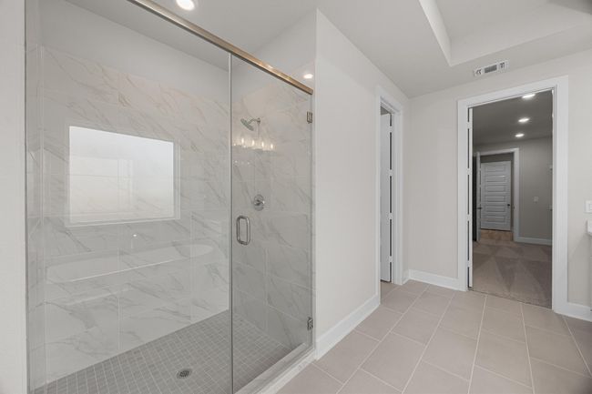 Full bath with a shower stall, baseboards, recessed lighting, and tile patterned flooring | Image 18