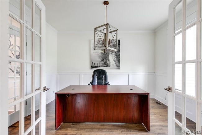Unfurnished office with ornamental molding, plenty of natural light, and wood-type flooring | Image 20