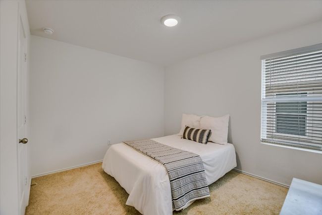 Bedroom featuring baseboards and carpet flooring | Image 14
