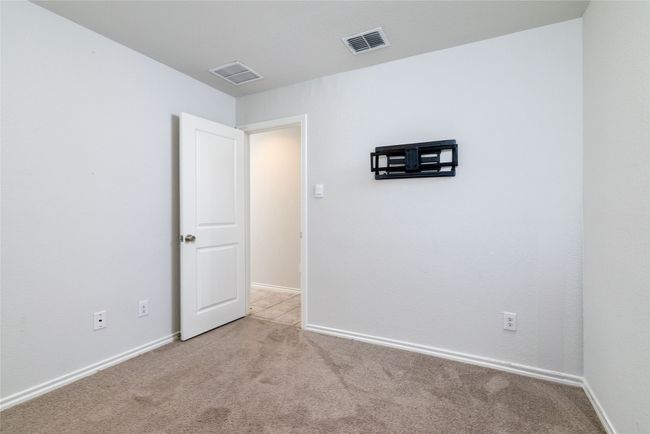 Empty room with light carpet and baseboards | Image 29