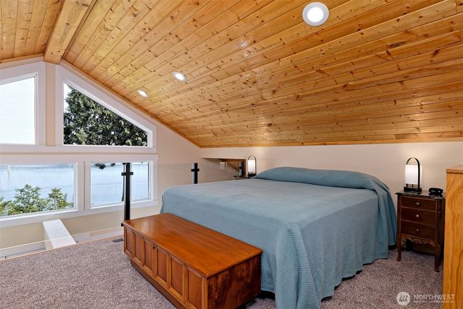 Loft bedroom with view and vaulted ceilings. | Image 22