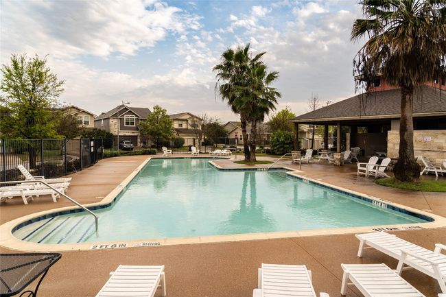 Community pool featuring a patio area and a residential view | Image 29