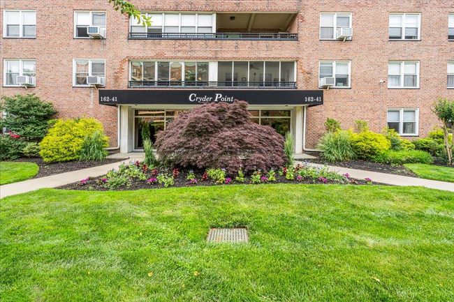 View of apartment building / complex with cooling unit | Image 17
