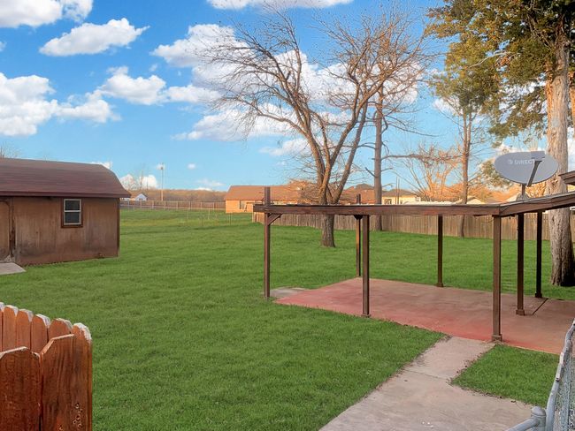 Large back yard on .49 acre lot. (Grass has been digitally edited to show potential) | Image 11