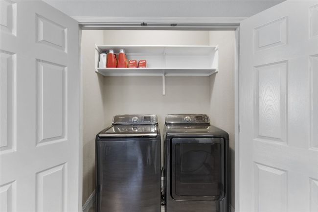 Laundry room with washing machine and dryer that convey with the home. | Image 11