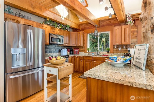 Beautiful kitchen with skylight and gorgeous exposed wood beams. | Image 7