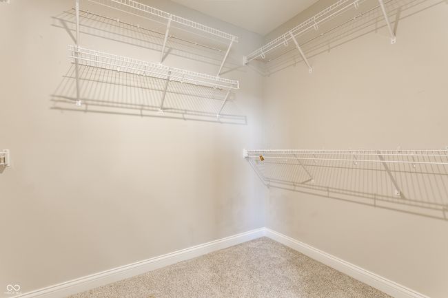 walk in closet with carpet | Image 31