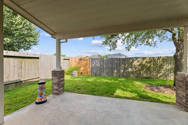 Backyard comes with covered patio area and a Tuff shed for additional storage | Image 38