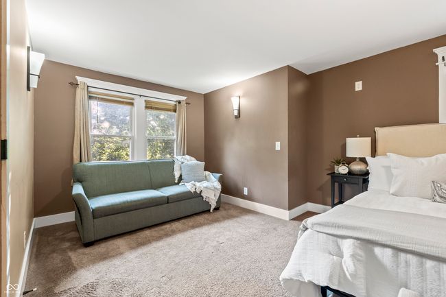 carpeted bedroom featuring baseboards | Image 32
