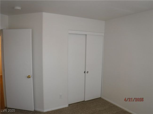 Guest bedroom closet with new carpet | Image 13