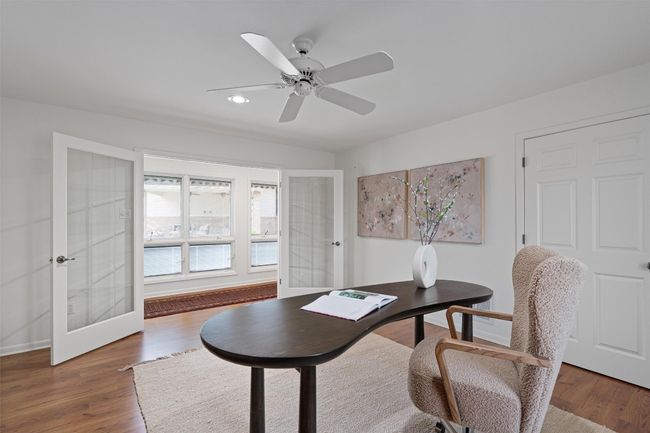 Even the office has a view of the pool and outdoor living area | Image 36
