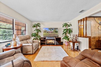 Formal Living Room w/ Hardwood Floors & Half Wall w/ Colonial Spindles | Image 2